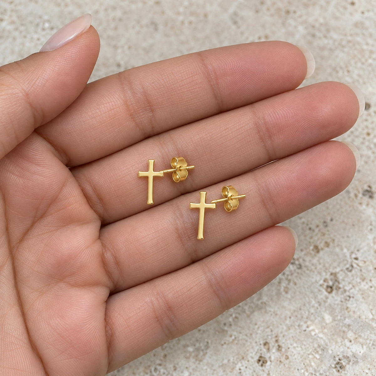 The Cross Studs held in hand, showing its true scale
