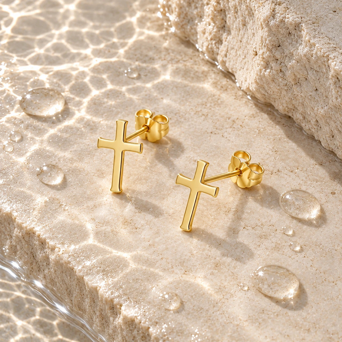 The Cross Studs with water droplets on stone