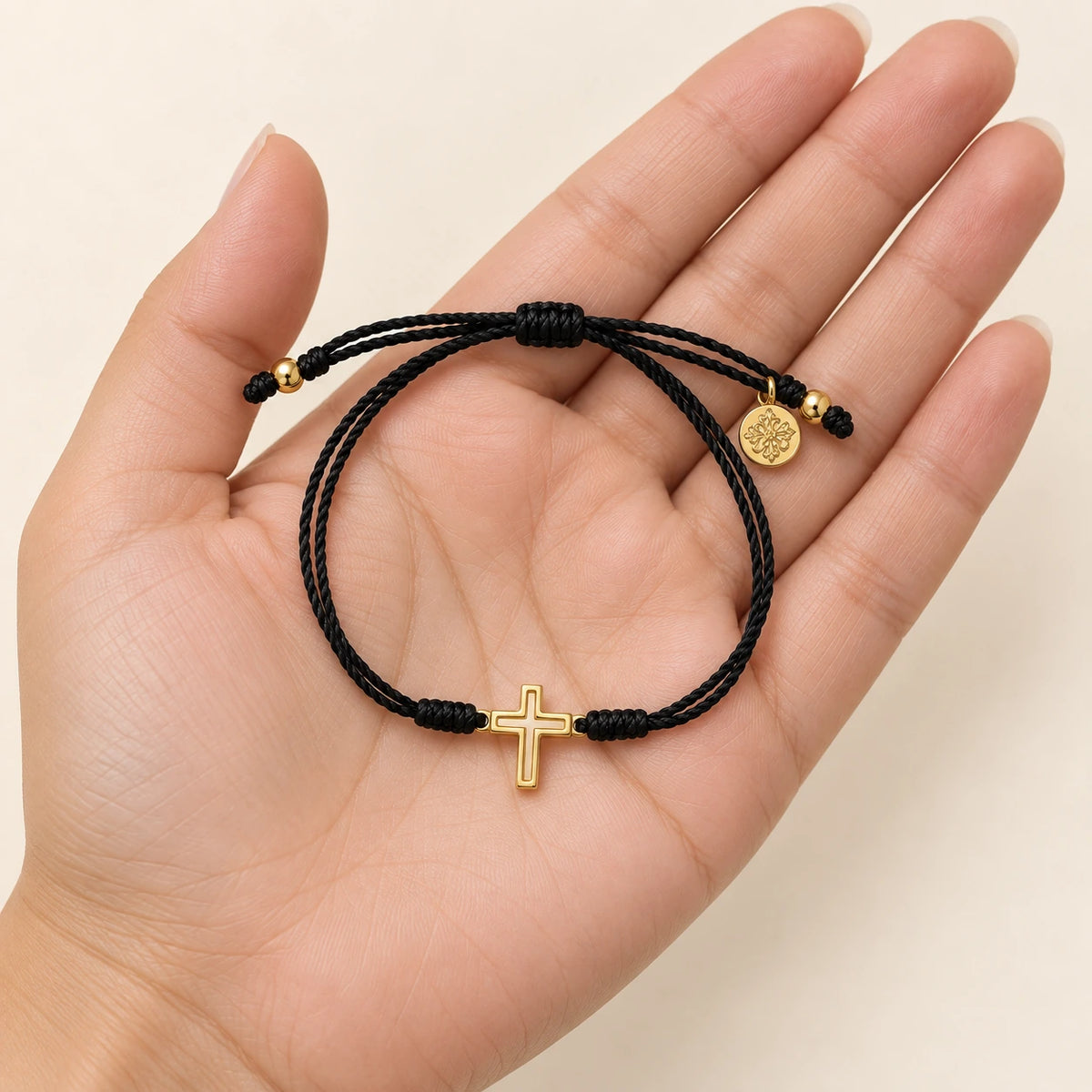 The Faith Bracelet held in hand, showing its true scale