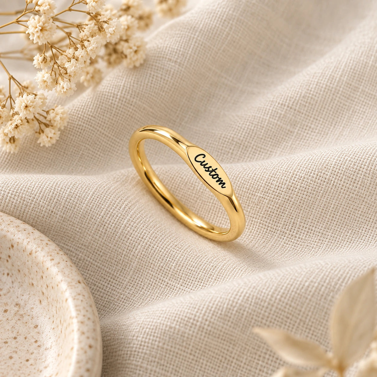 The Initial Ring laid flat on linen