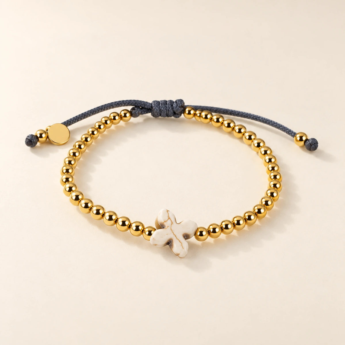 The Prayer Bracelet, gold-plated stainless steel, shown on its own