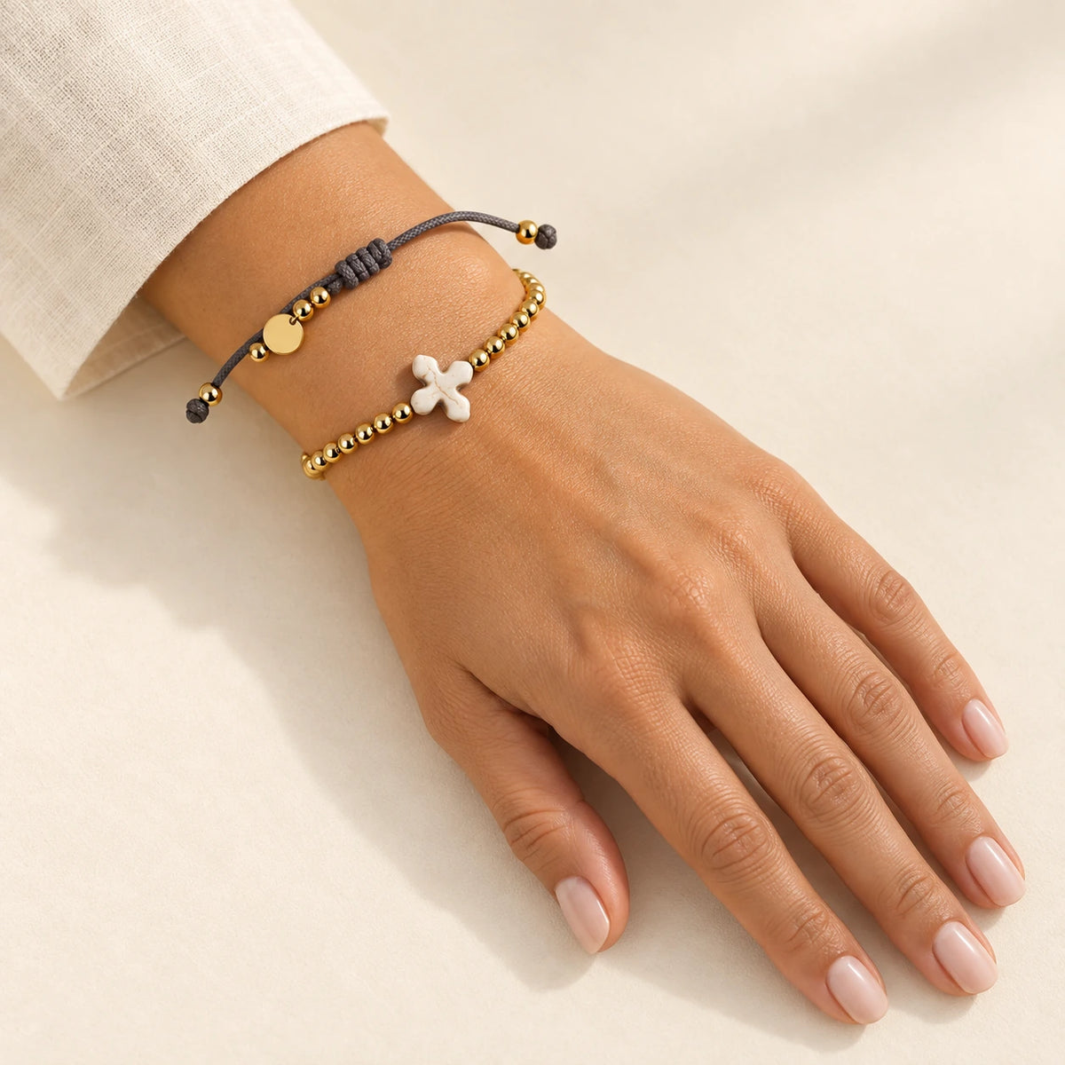 The Prayer Bracelet worn, gold-plated stainless steel