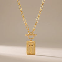 Chosen, a sealed 18K gold pendant necklace, on a plain background