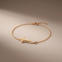 Communion Bracelet, a sealed 18K gold bracelet, on a plain background