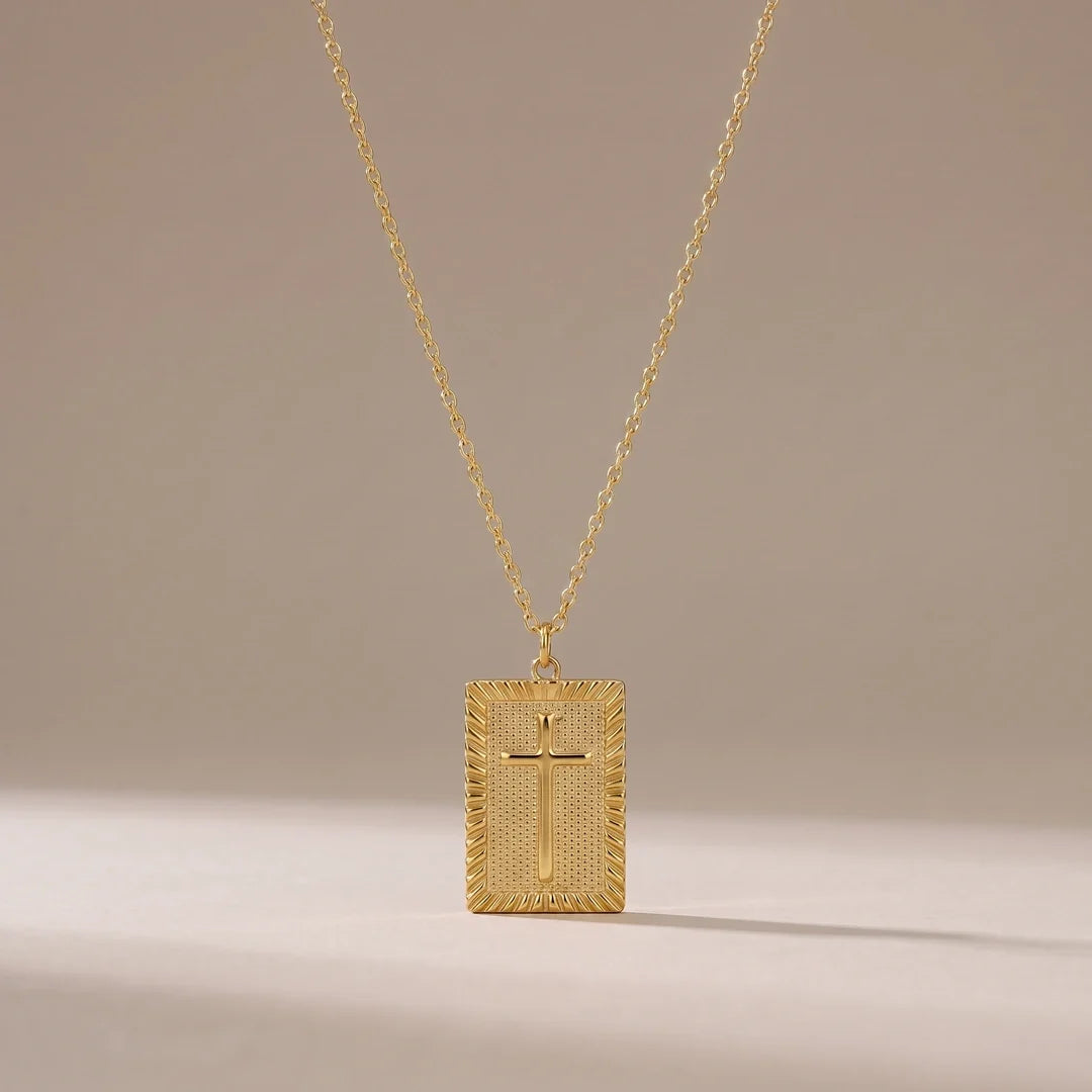 First Blessing, a sealed 18K gold pendant necklace, on a plain background