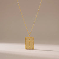First Blessing, a sealed 18K gold pendant necklace, on a plain background