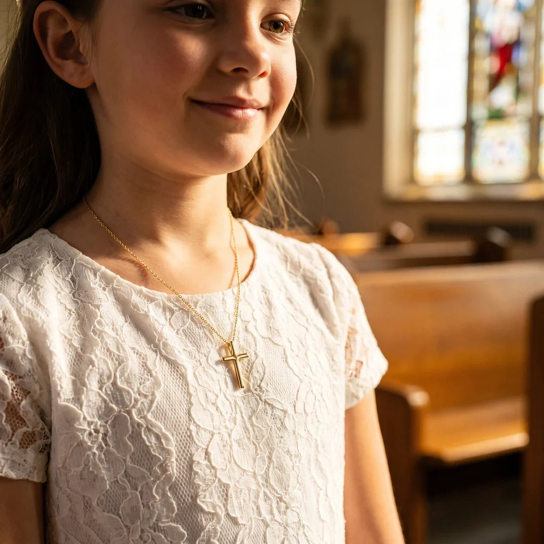 Milestone Cross, a sealed 18K gold cross necklace, a keepsake gift for First Communion