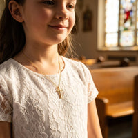 Milestone Cross, a sealed 18K gold cross necklace, a keepsake gift for First Communion