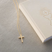 Milestone Cross, a sealed 18K gold cross necklace, a keepsake gift for First Communion