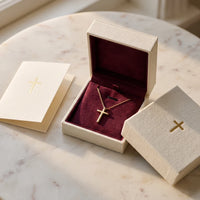 Milestone Cross, a sealed 18K gold cross necklace, a keepsake gift for First Communion