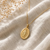 Our Lady Watches, a sealed 18K gold Our Lady medal necklace, a keepsake gift for protection