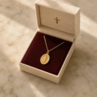 Our Lady Watches, a sealed 18K gold Our Lady medal necklace, a keepsake gift for protection