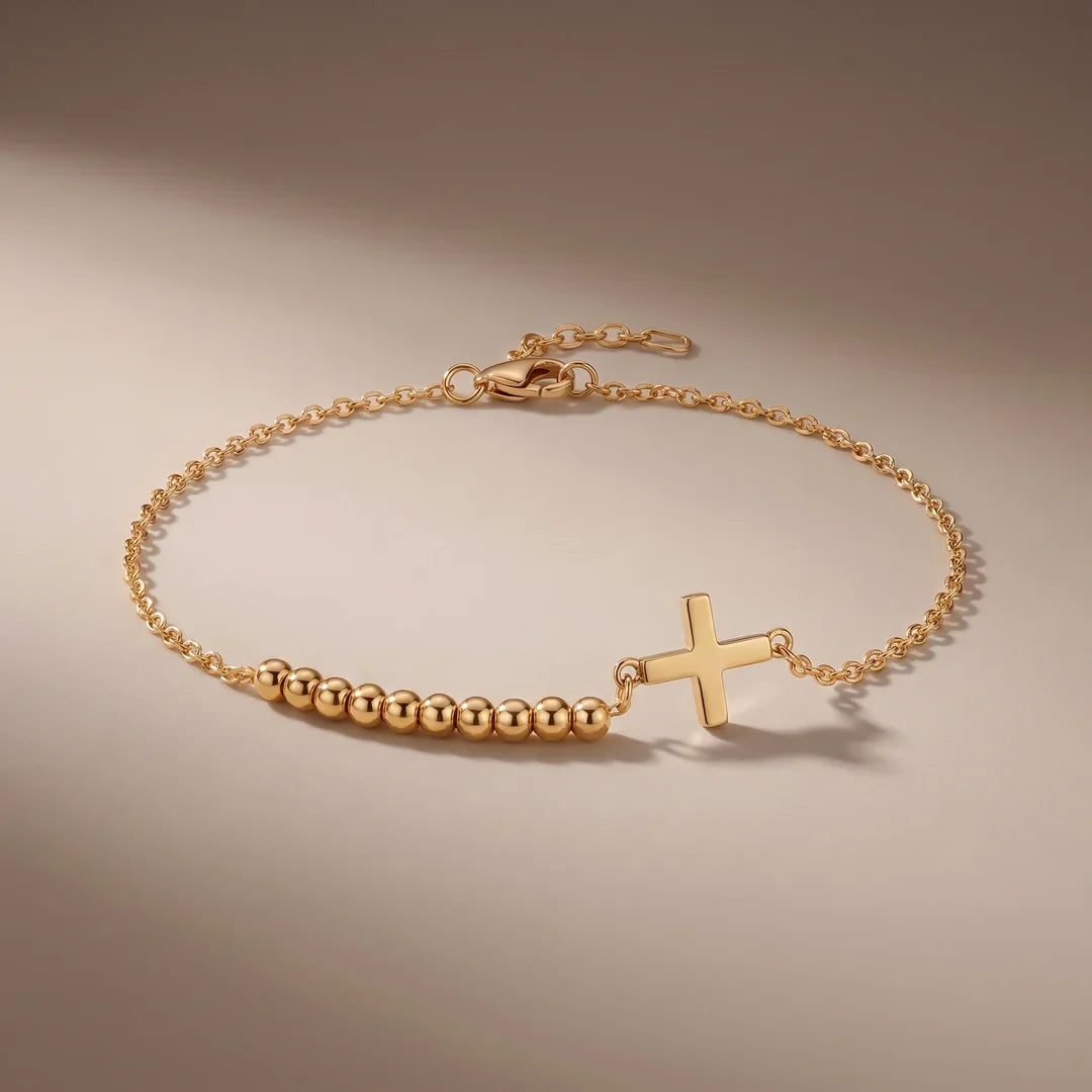 Rosary Bracelet, a sealed 18K gold rosary bracelet, on a plain background