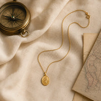 Safe Travels, a sealed 18K gold St. Christopher medal necklace, a keepsake gift for safe travels